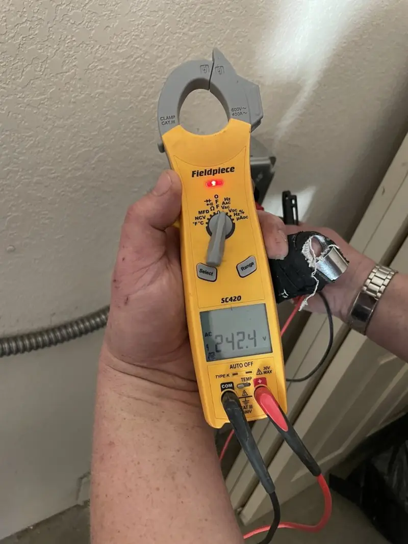 Voltage testing with clamp meter during Electrical Installation Services in Lakehills